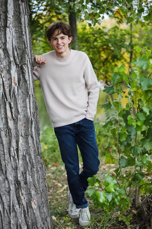Picture of Mark standing by a tree